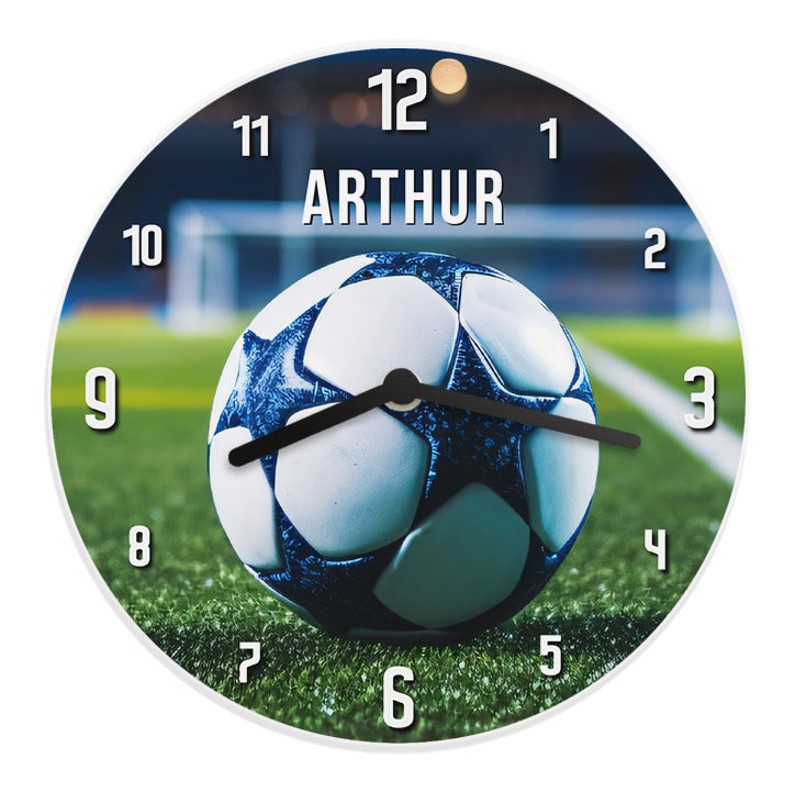 Wall clock with soccer ball design and 'Arthur' branding on a grass field background