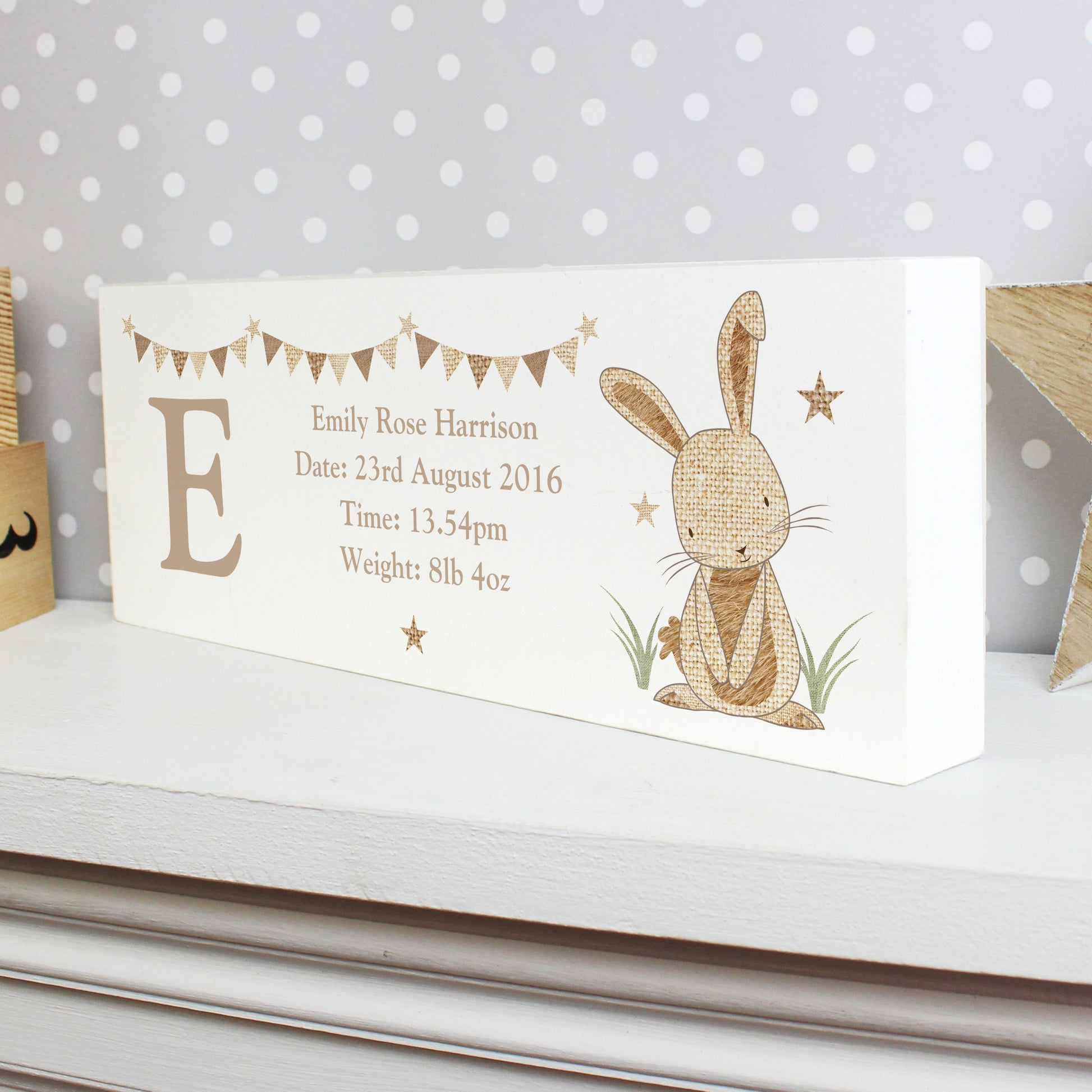 White decorative lock showing a cute rabbit and bunting. Birth details in text.