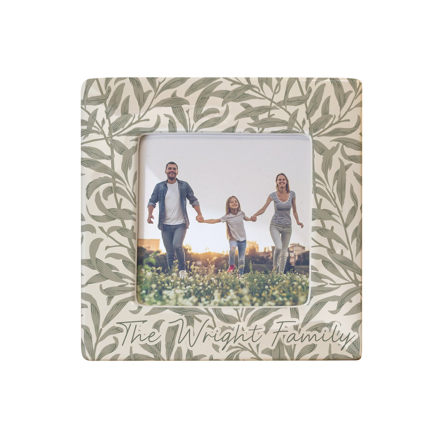 Decorative photo frame with leaf pattern and family photo inside