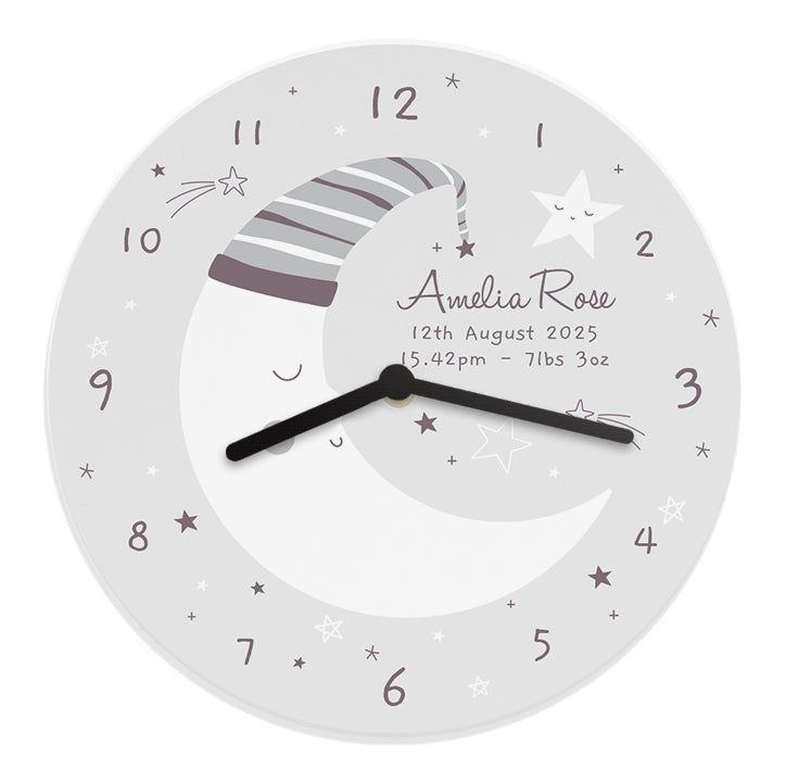 Round wall clock with moon and star design, personalized text, and black hands on a white background.