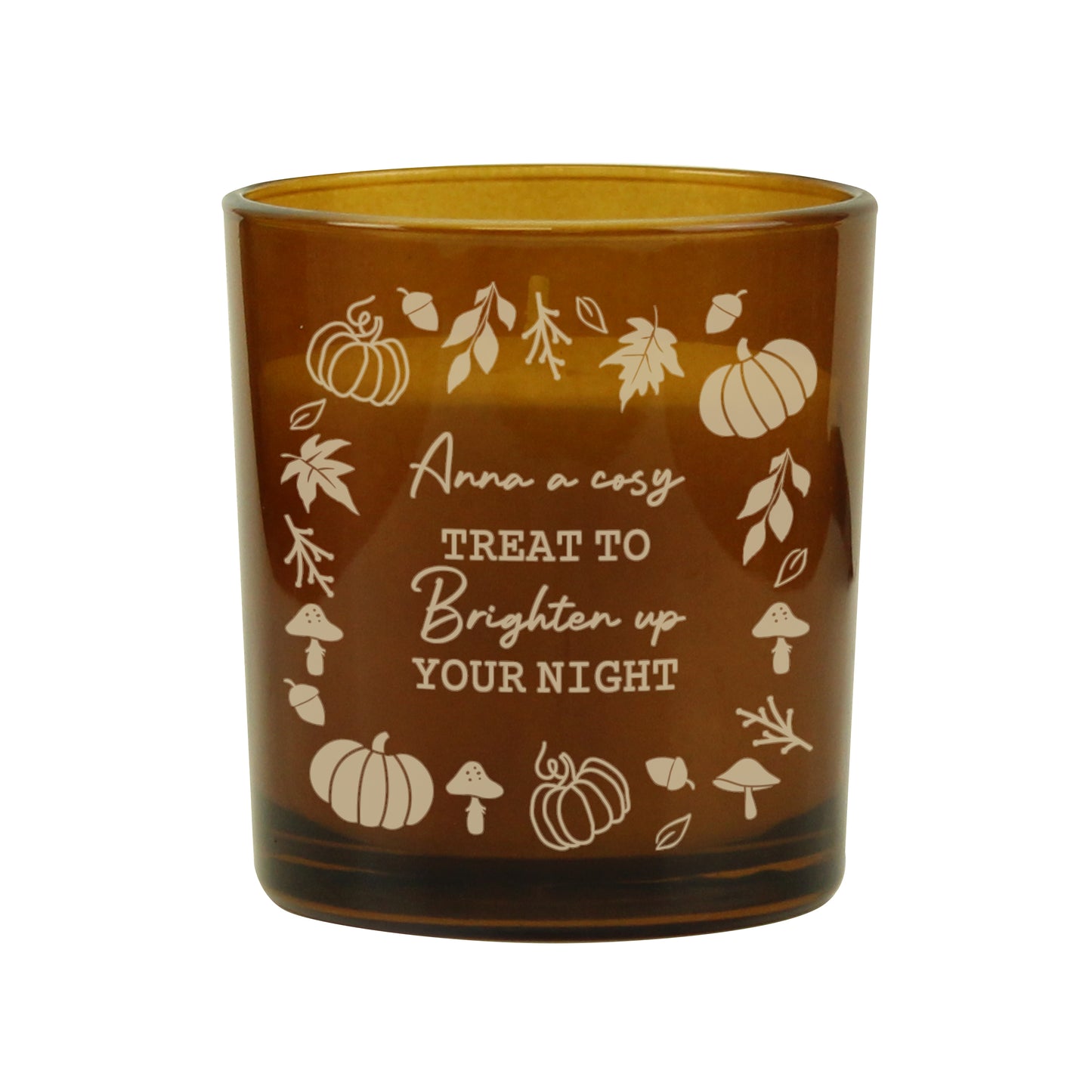Amber glass candle holder with autumn-themed design and text on a white background