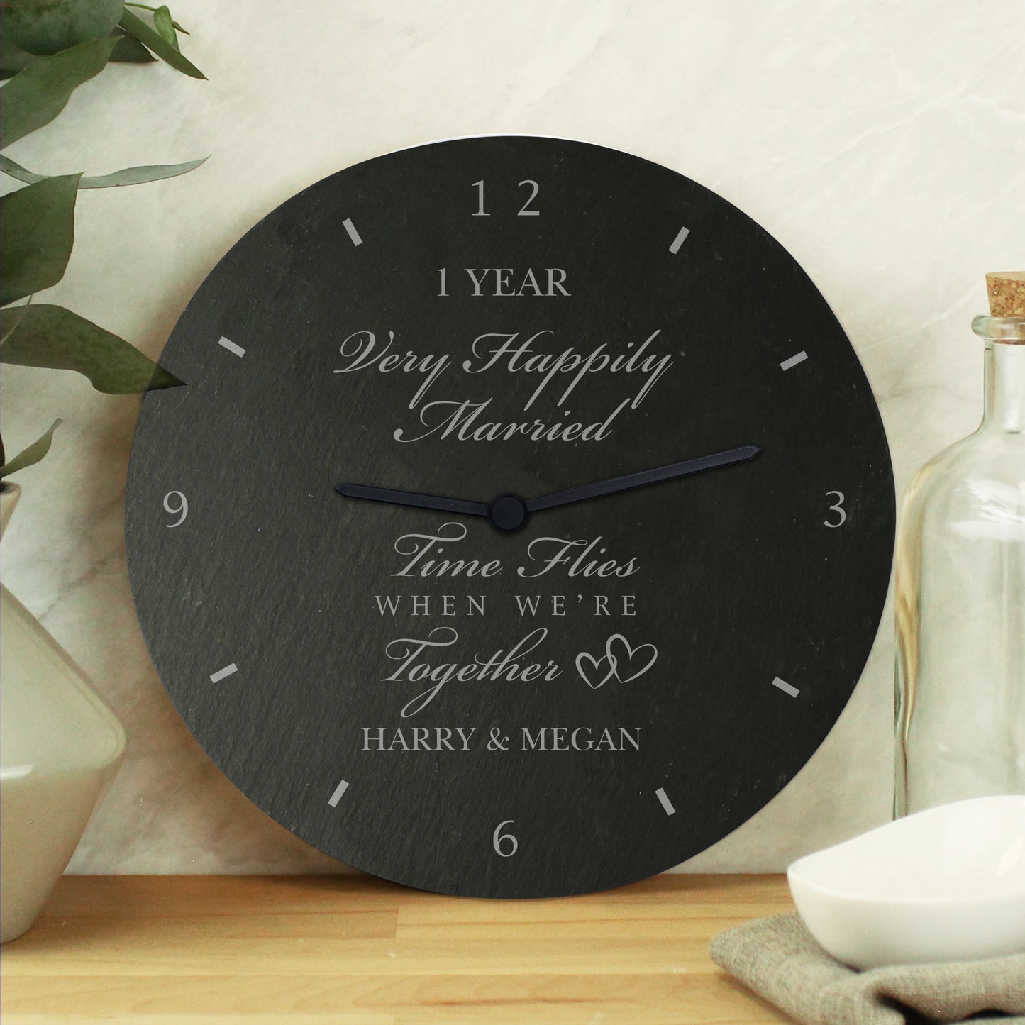 Decorative clock with personalised message on a wooden surface