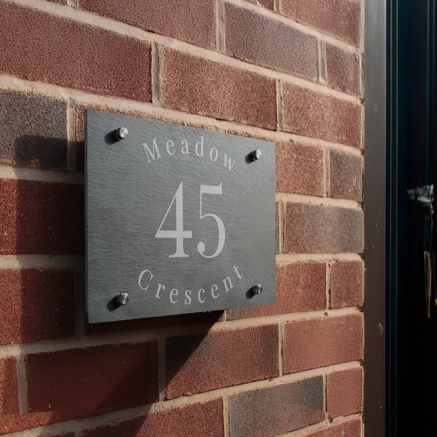 House number sign on a brick wall