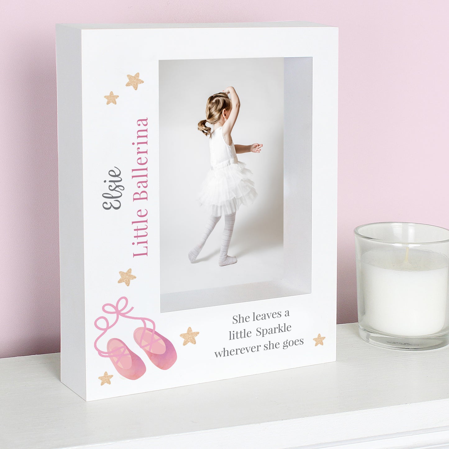 Photo frame with a ballerina-themed design on a pink background