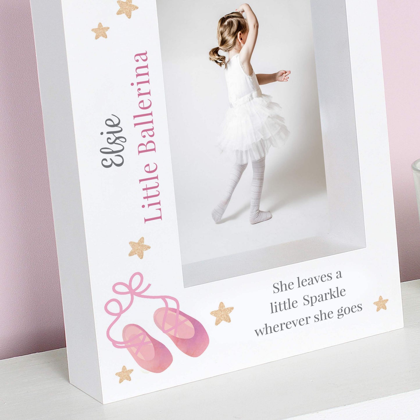 Personalized photo frame with a ballerina design and text on a white surface.