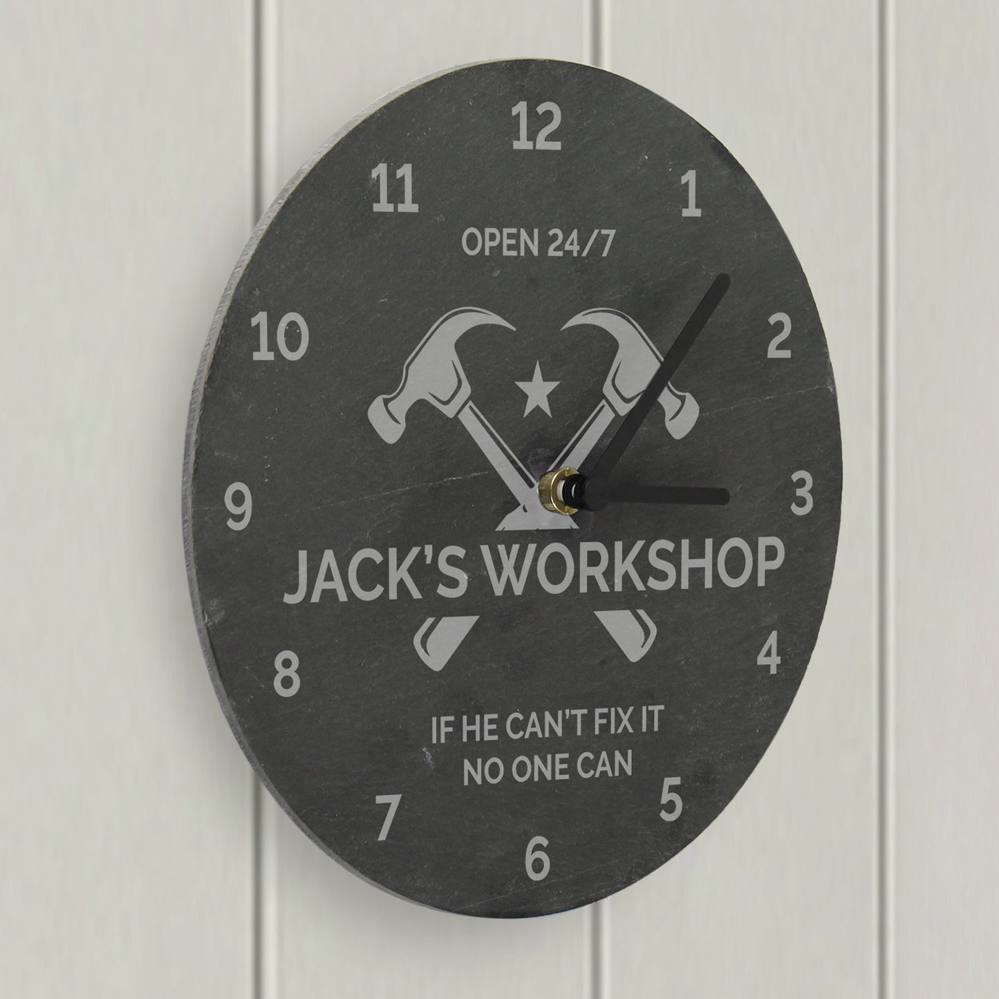Wall clock with 'Jack's Workshop' design on a white background