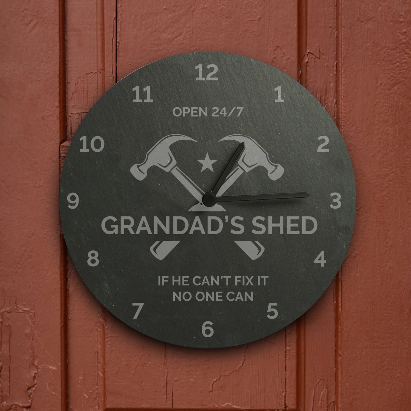 Wall clock with 'Grandad's Shed' design on a red wooden background