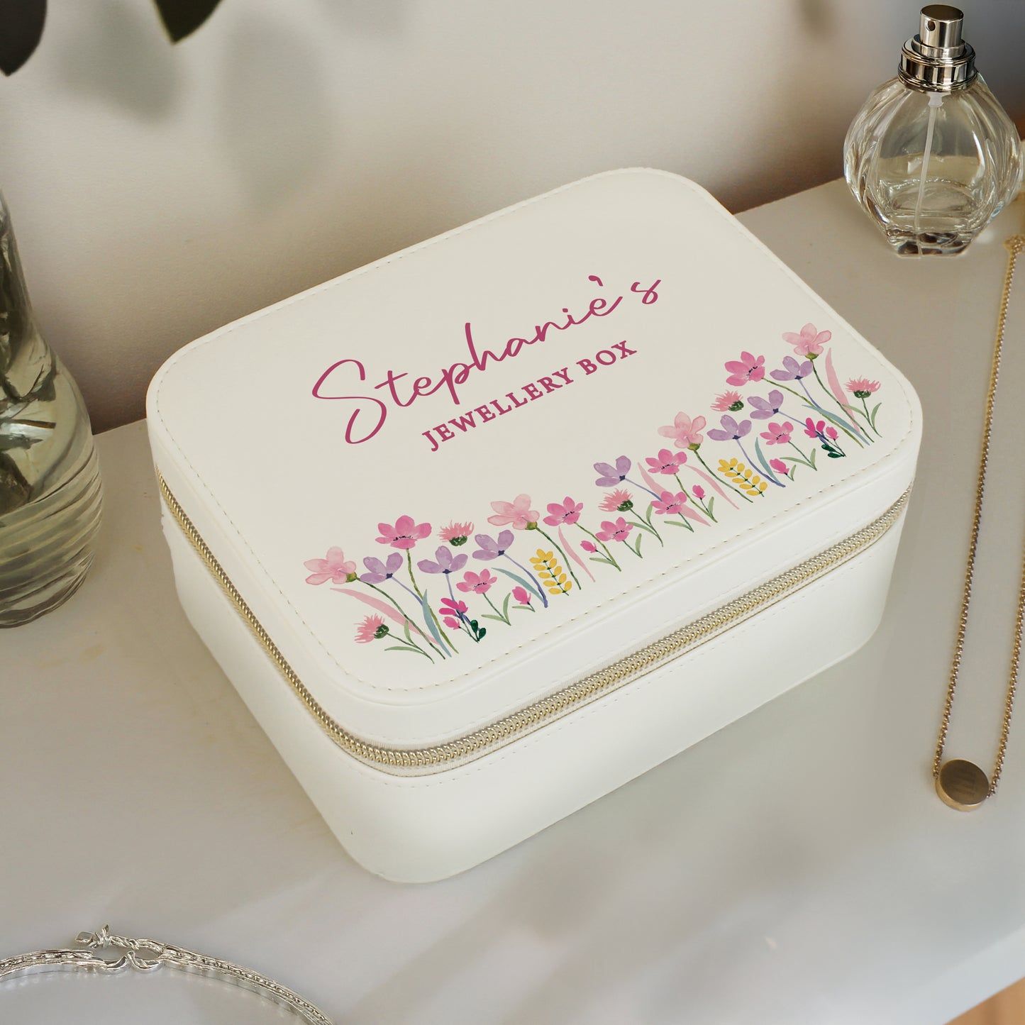 Personalised jewellery box with floral design and personalised name on a table.