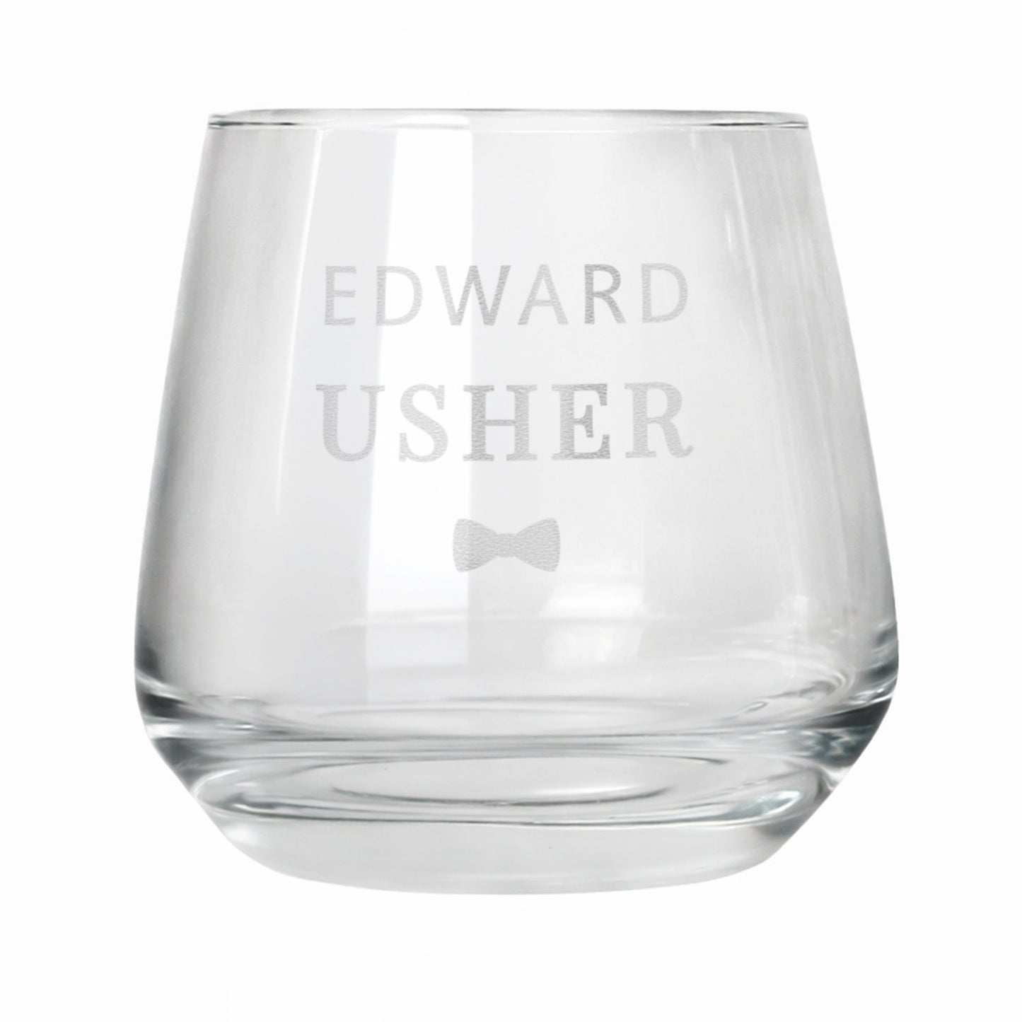 Clear glass tumbler with engraved text 'GEORGE Vintage 1985' on a white background