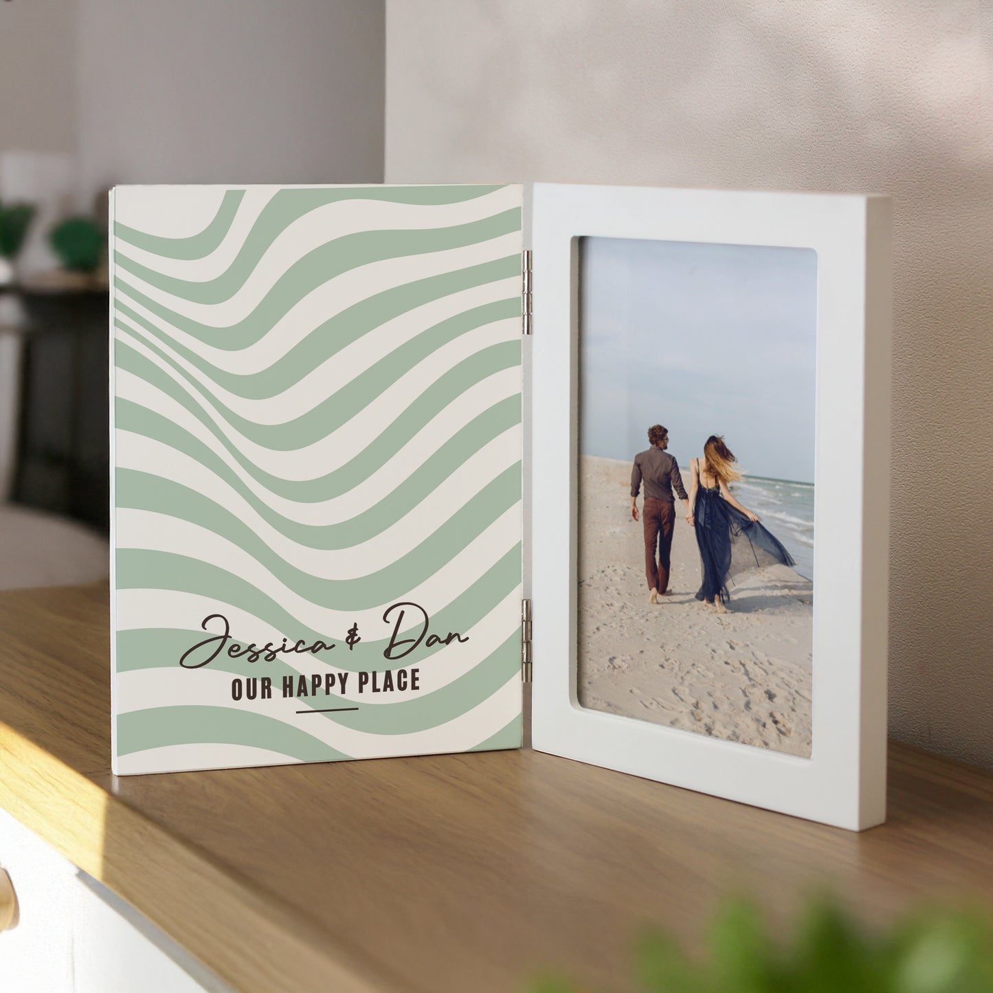 Personalised photo album with wavy design and couple on beach