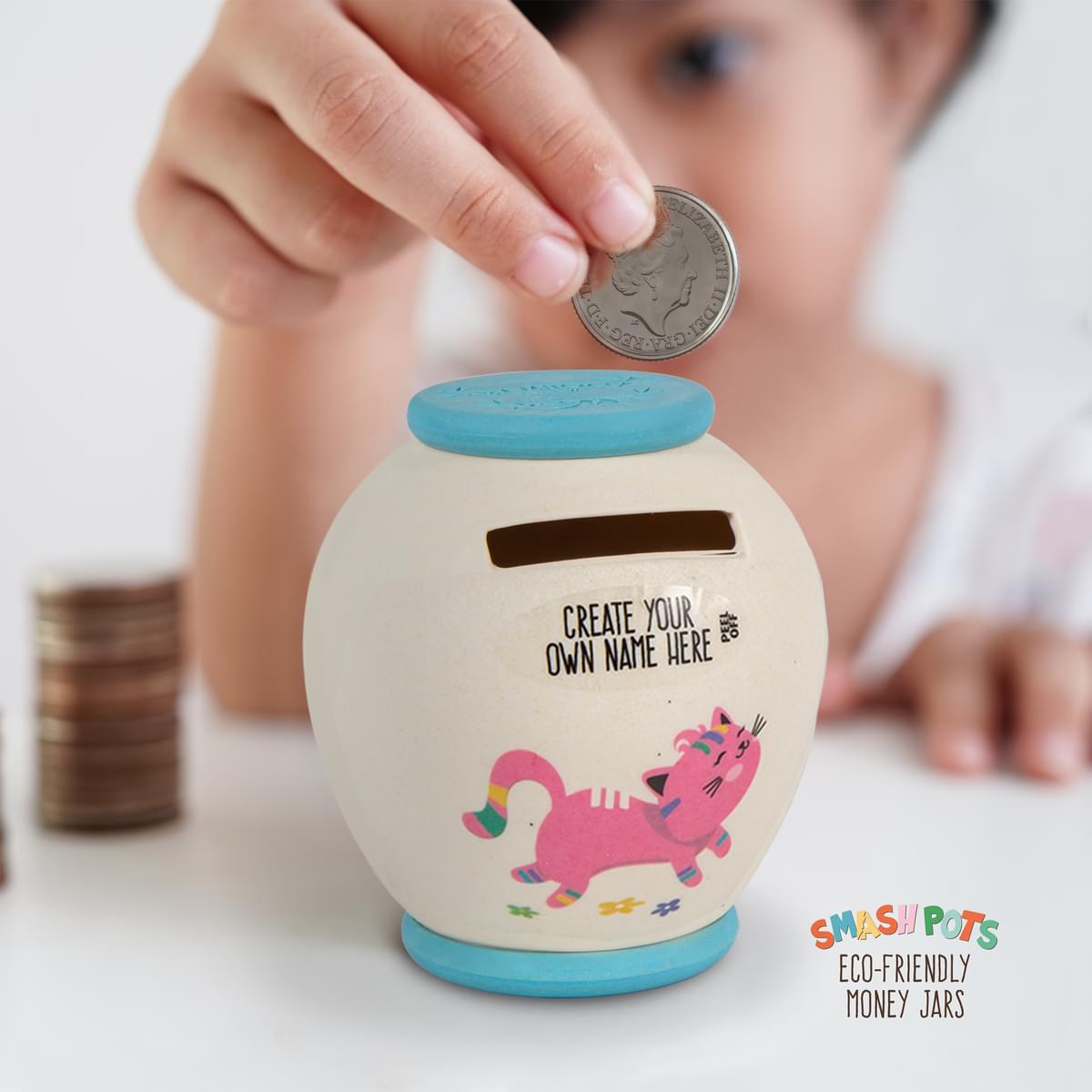 Small Smash Pot in ivory with blue top and base. With colourful kitten image. Create own name. Once full, smash to empty and bury in the compost.