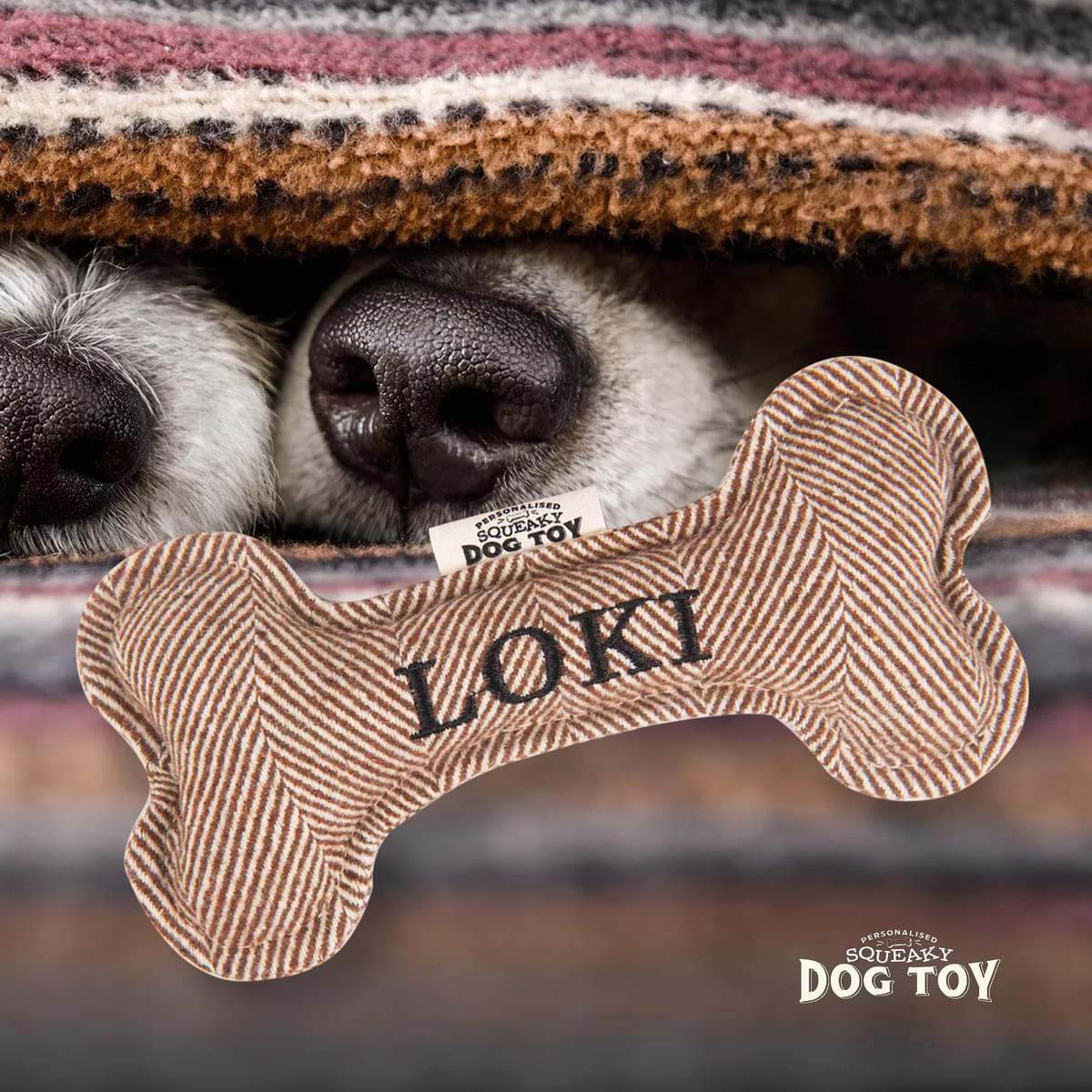 Named Squeaky Dog Toy- Loki. Bone shaped herringbone tweed pattern dog toy.