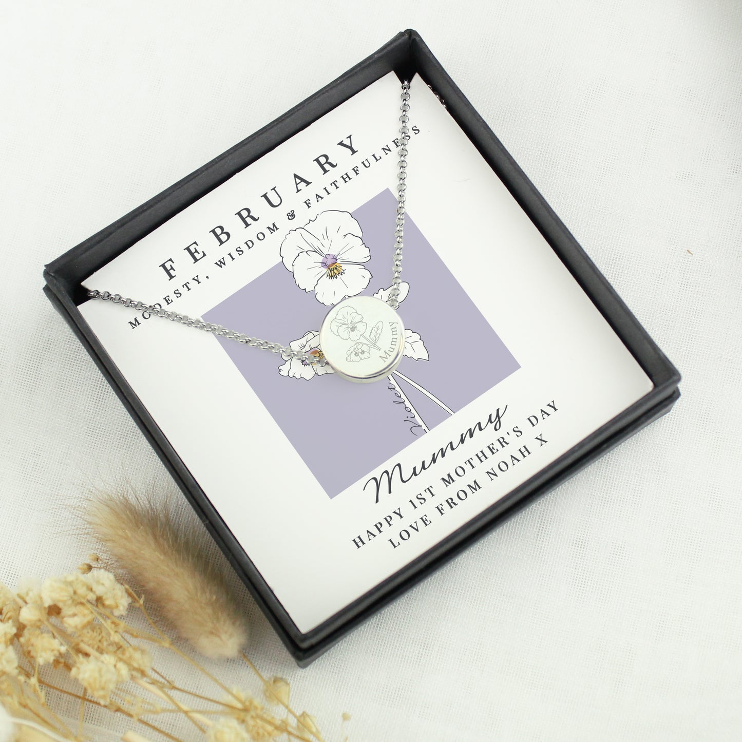Necklace with floral design in a gift box and February backing card