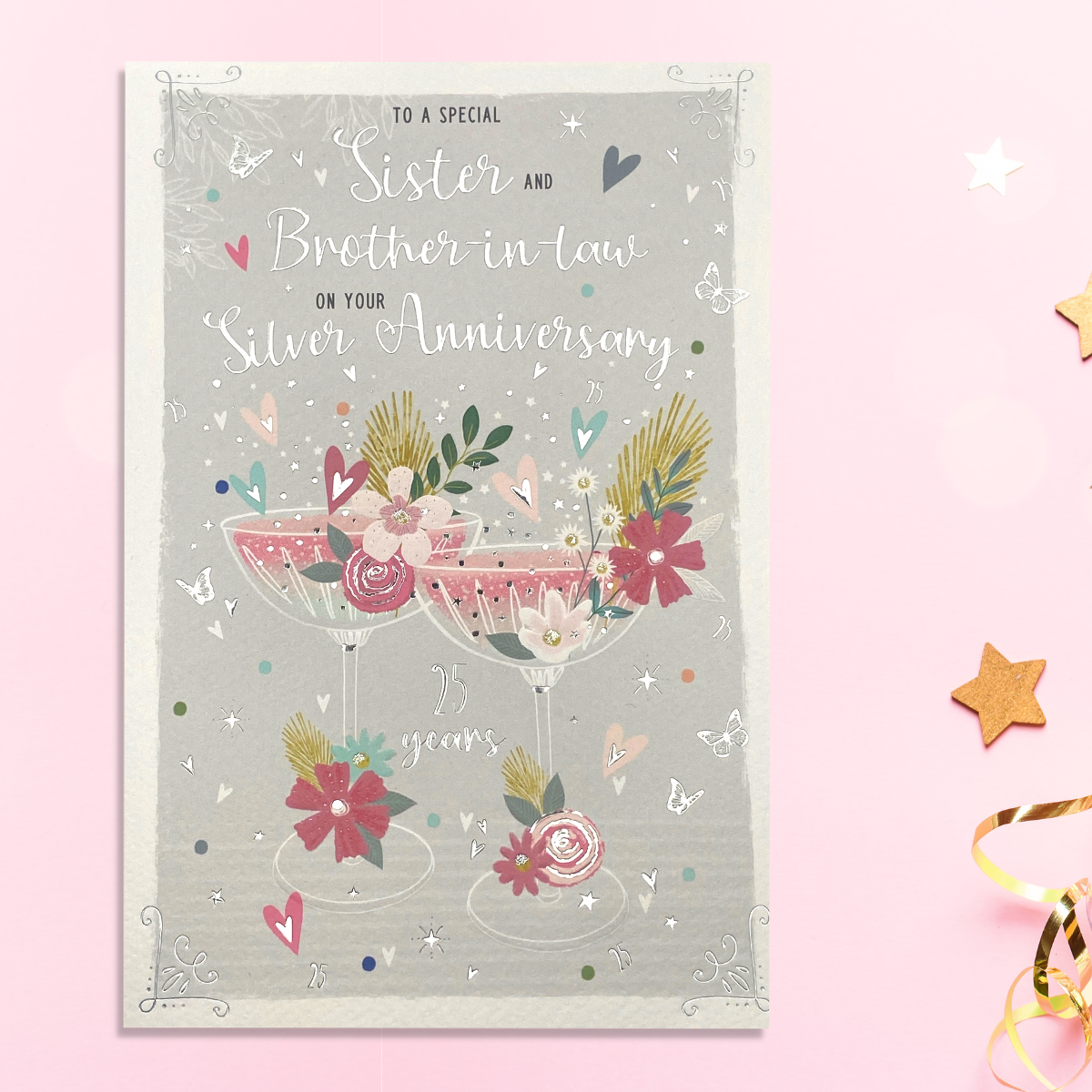 Front image with two cocktail glasses with flowers and hearts