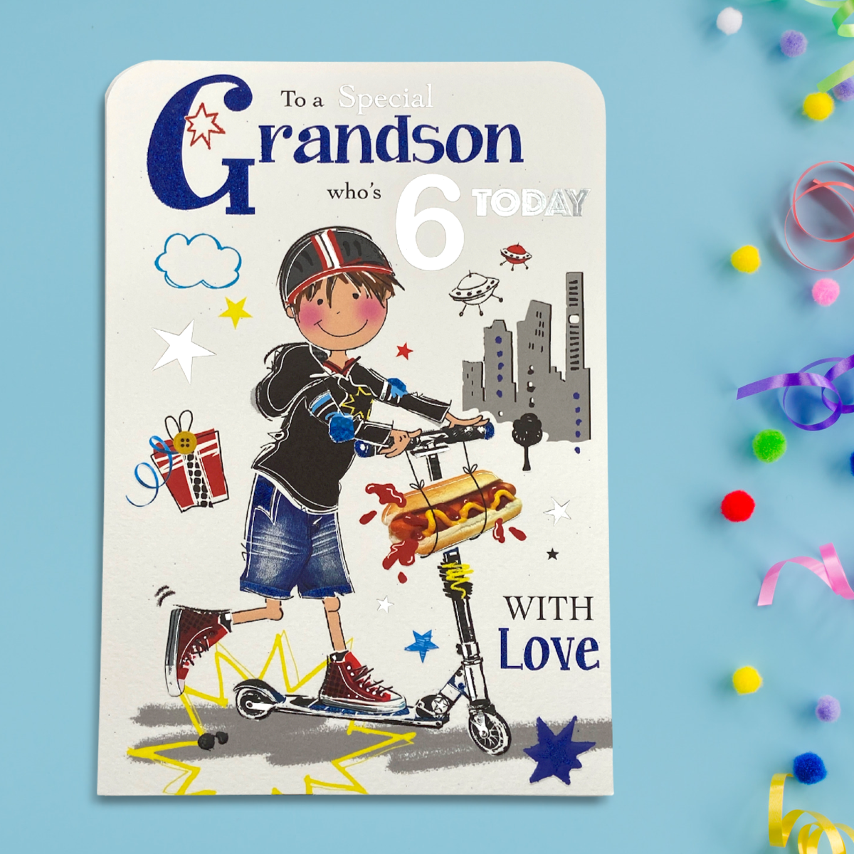 grandson age 6 front image with boy on scooter with hotdog