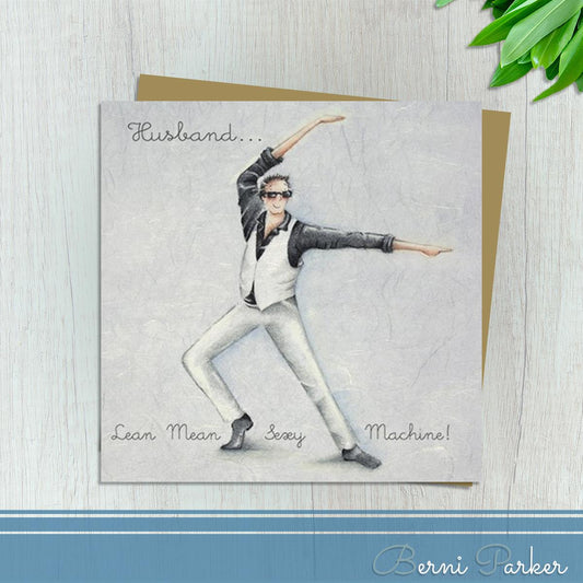 Husband Card Showing Man In Black Shirt, Trousers and Waistcoat With Spiky Hair And Sunglasses Striking A Pose! Caption: Husband...Lean, Mean, Sexy Machine. Blank Inside For Your Own Message. Complete With Brown Kraft Envelope