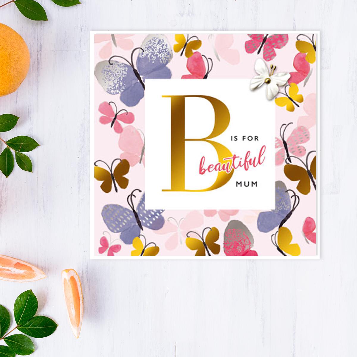 Butterfly Themed Mother's Day Design Alongside Its White Envelope