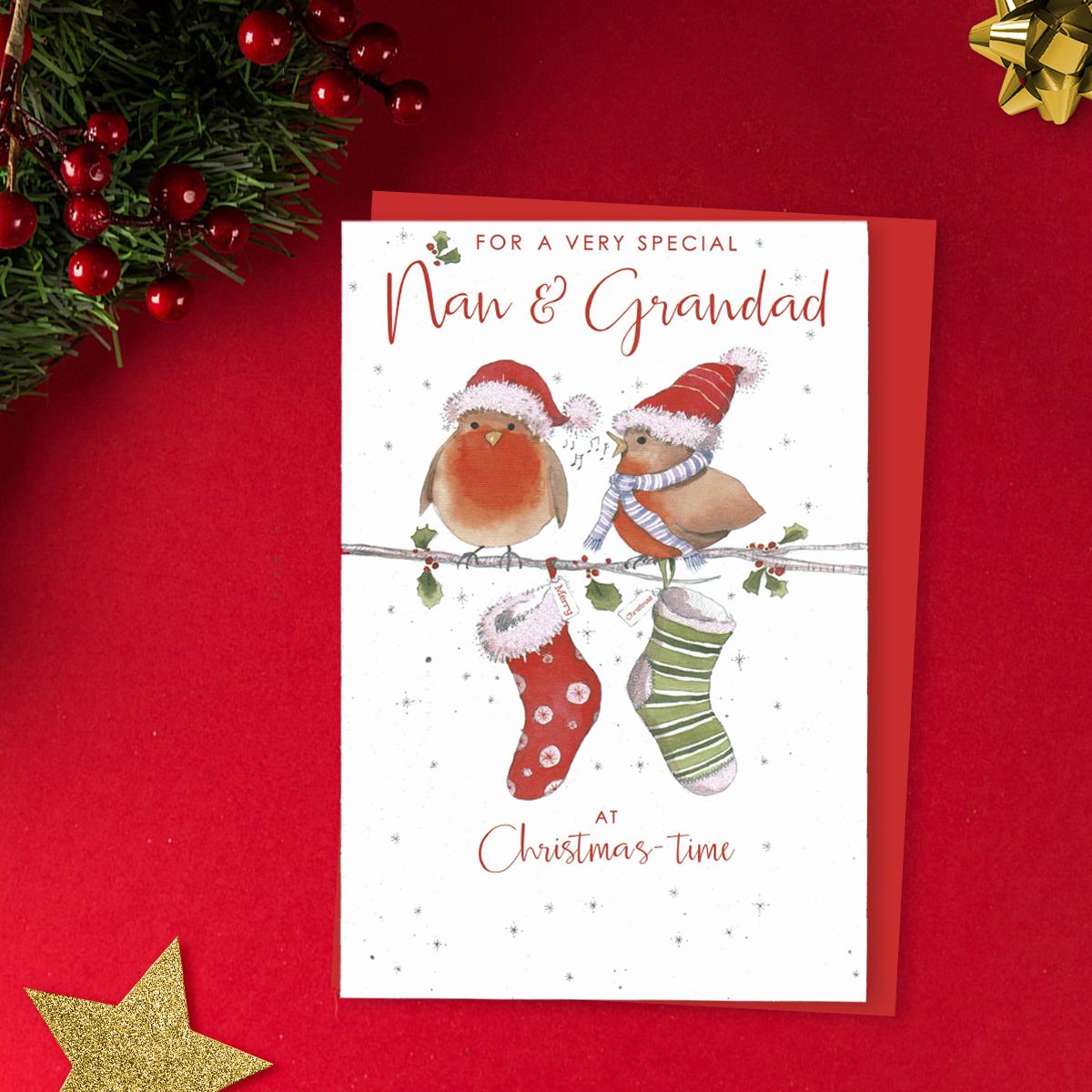 Nan And Grandad Christmas Card Alongside Its Red Envelope