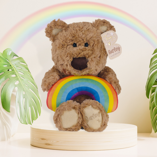 Barley Bear Plush Holding A Rainbow Displayed In Full