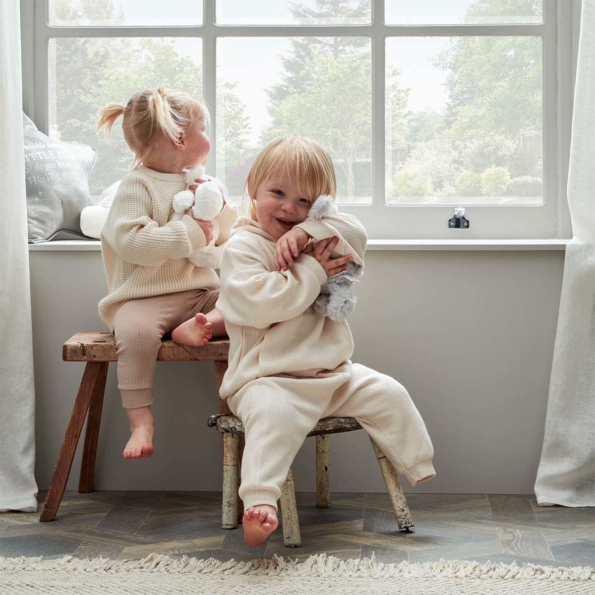 Image Showing Young Children Holding On To Their Rabbits