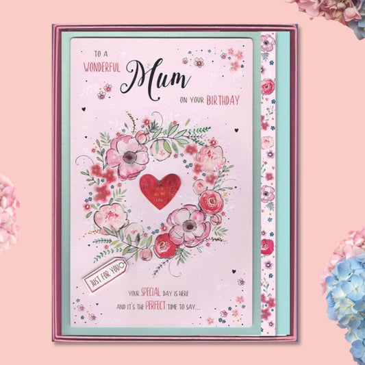 Large pink card with floral wreath and heart presented in gift box