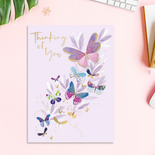 Lilac card with butterflies in flight