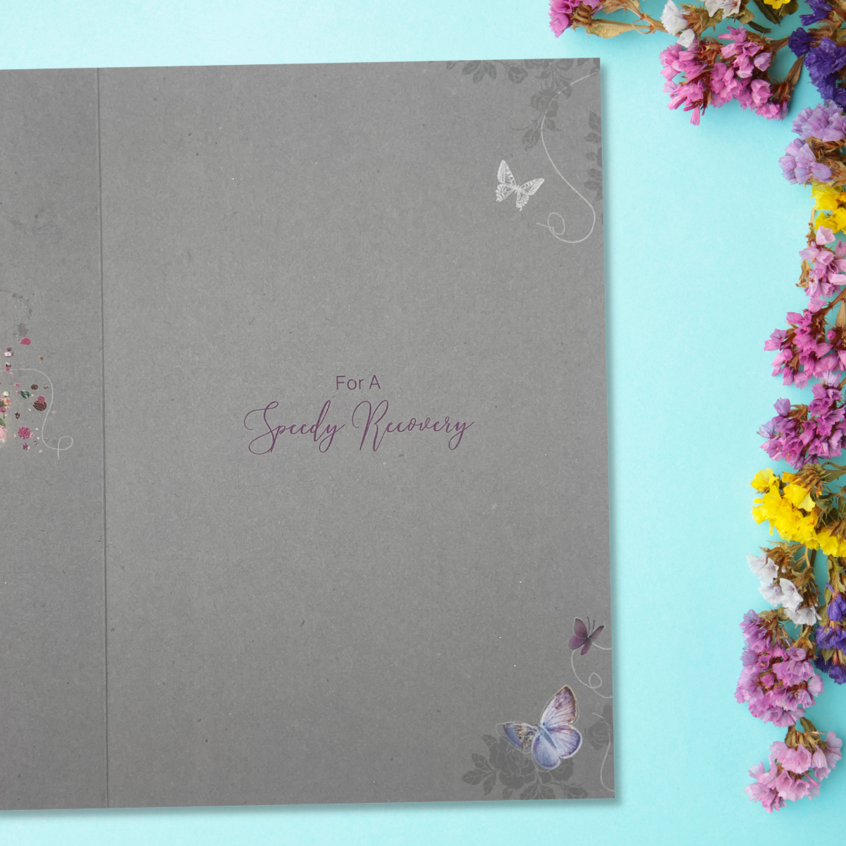 inside grey card with colour print and butterflies