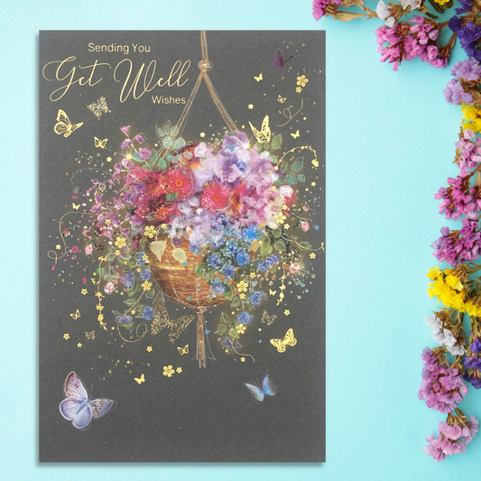 Front image with floral hanging basket, gold foil text and butterflies