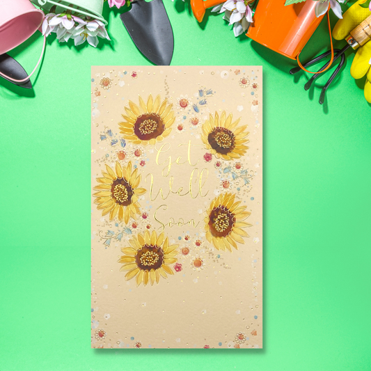 Front image showing peach colour card with sunflowers and gold get well soon text