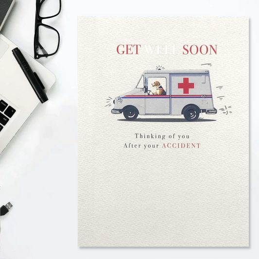 Front image showing dog driving ambulance with red and silver text