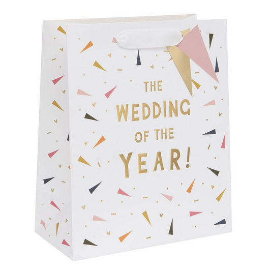 White bag with confetti and gold text