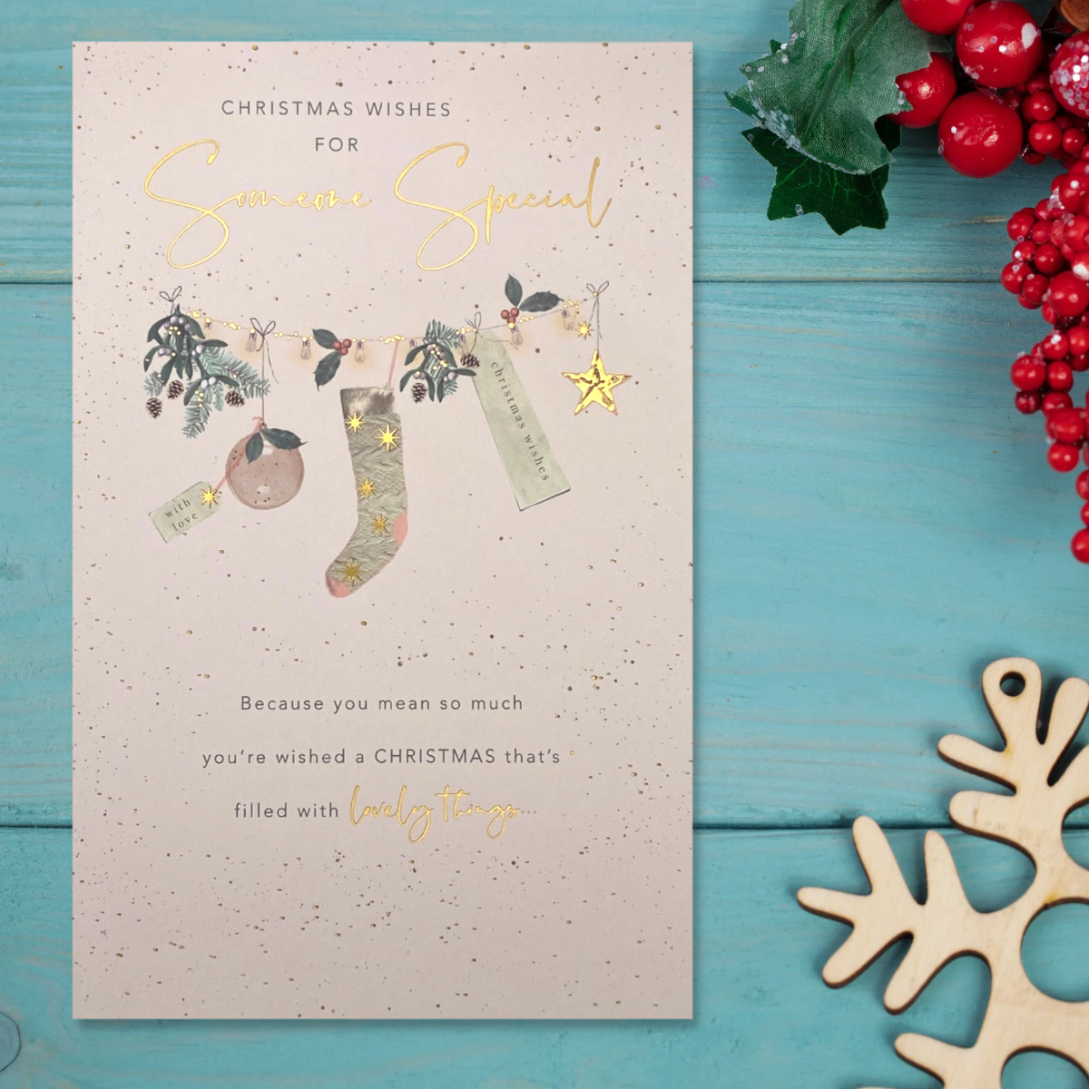 Front image with cream design and christmas stocking with verse