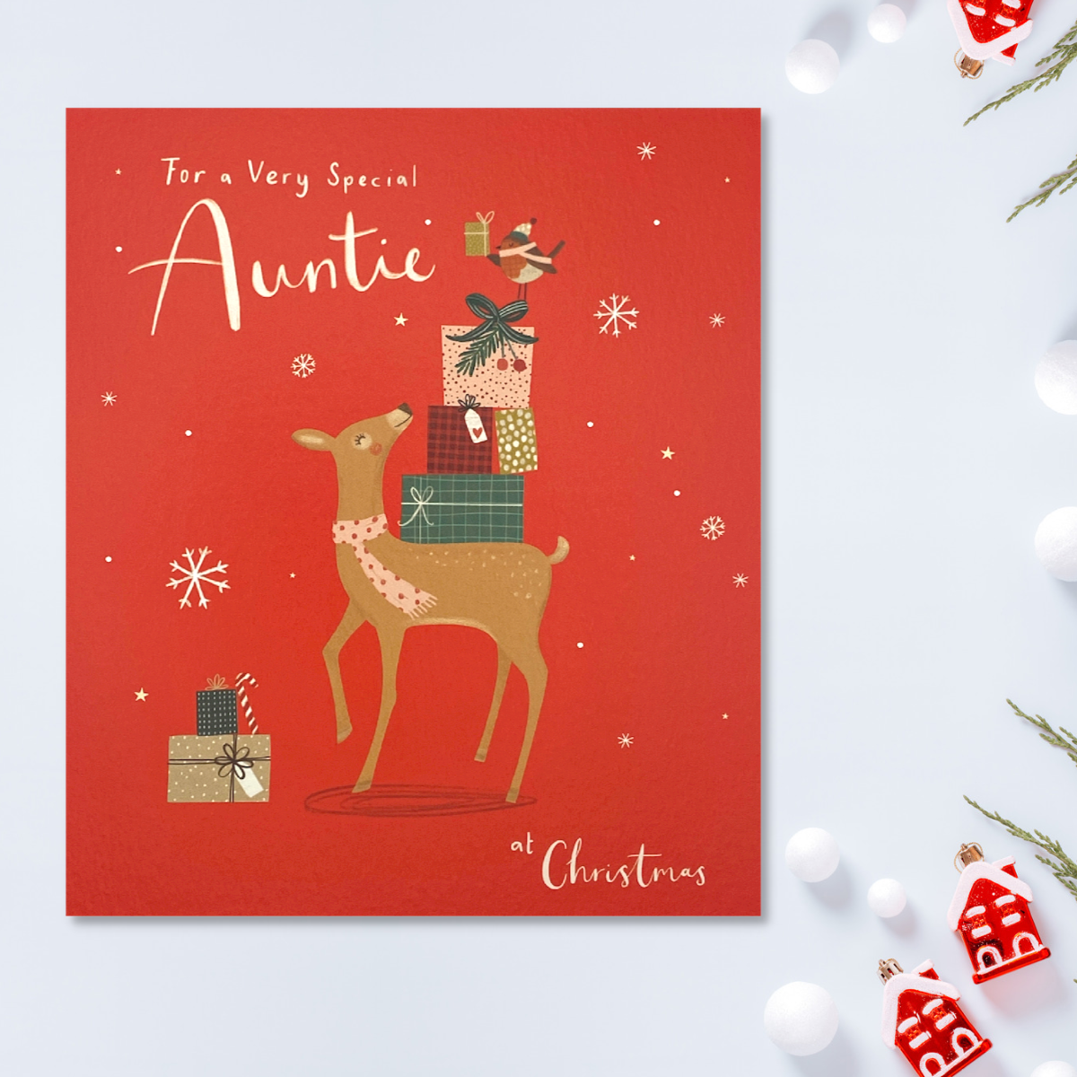 Red square card with reindeer and gifts