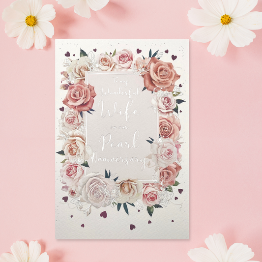 Silver text surrounded by roses border