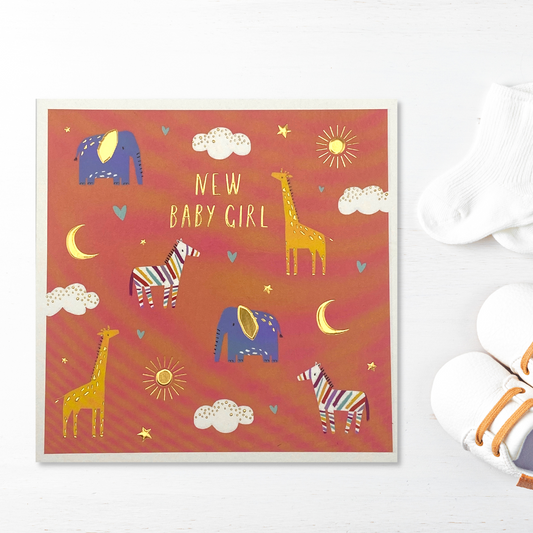 Square baby card with orange background and selection of jungle animals, starts, hearts, moon and sun