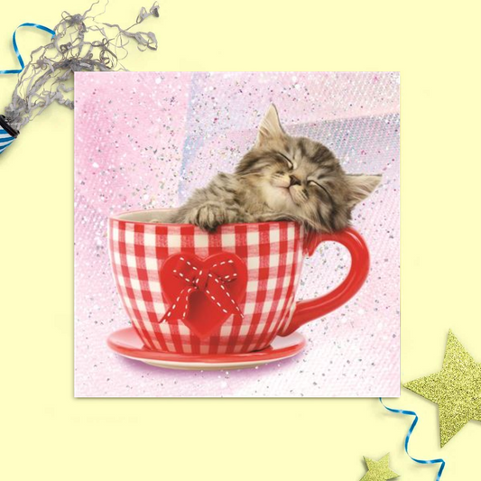 Pink card with silver glitter featuring a cute kitten in a red and white teacup
