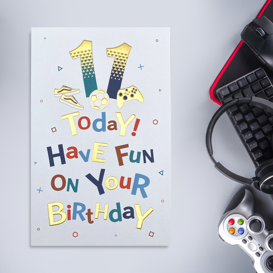 White card with colourful text, gaming illustrations and gold foil details