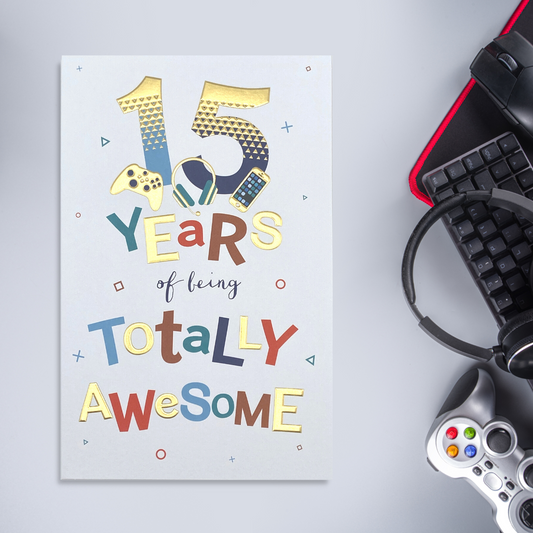 White card with bold colour text, gamer illustrations and gold foil details