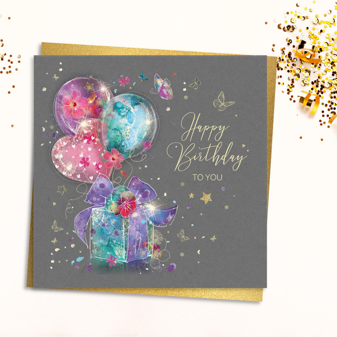 Grey square card with colourful gift and balloons with gold foil details