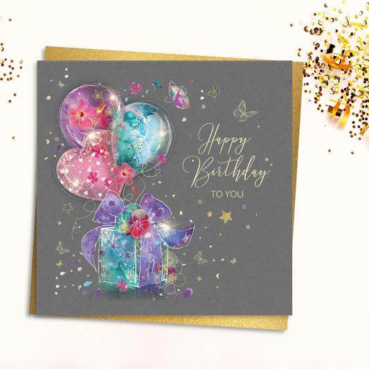 Grey square card with colourful gift and balloons with gold foil details