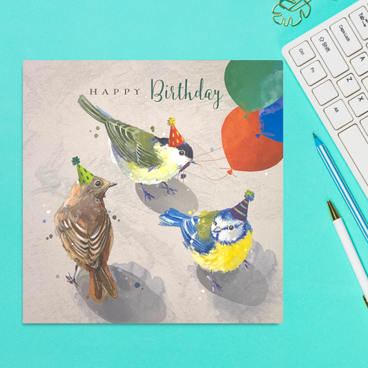 Square card featuring three painted birds with balloons
