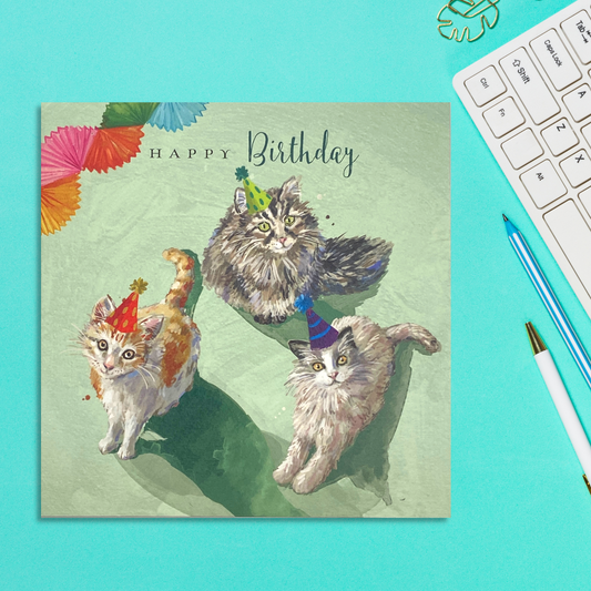 Square card featuring three cats in party hats