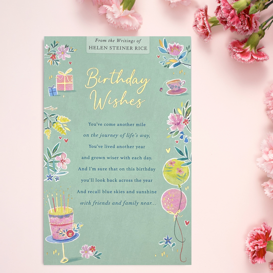 Aqua colour card with floral border and balloons, teacup and cake with verse