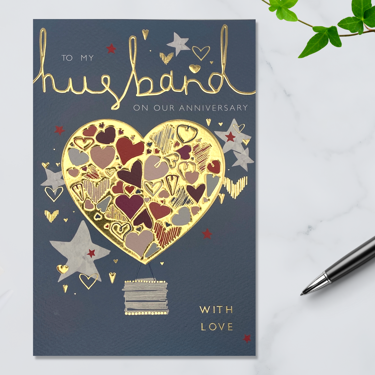 Grey card with gold foil heart and text