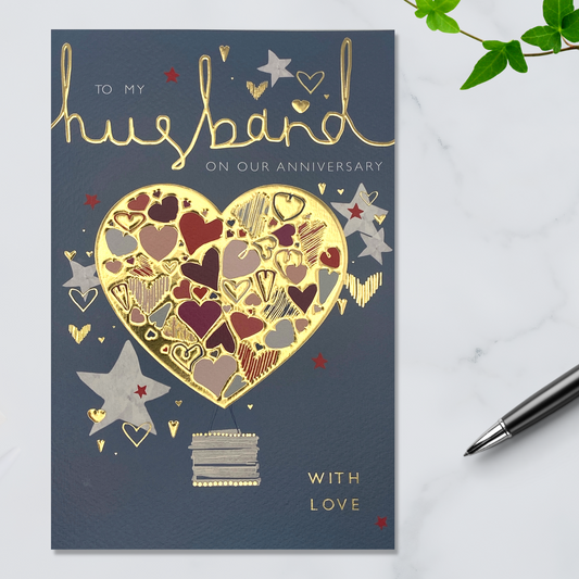 Grey card with gold foil heart and text