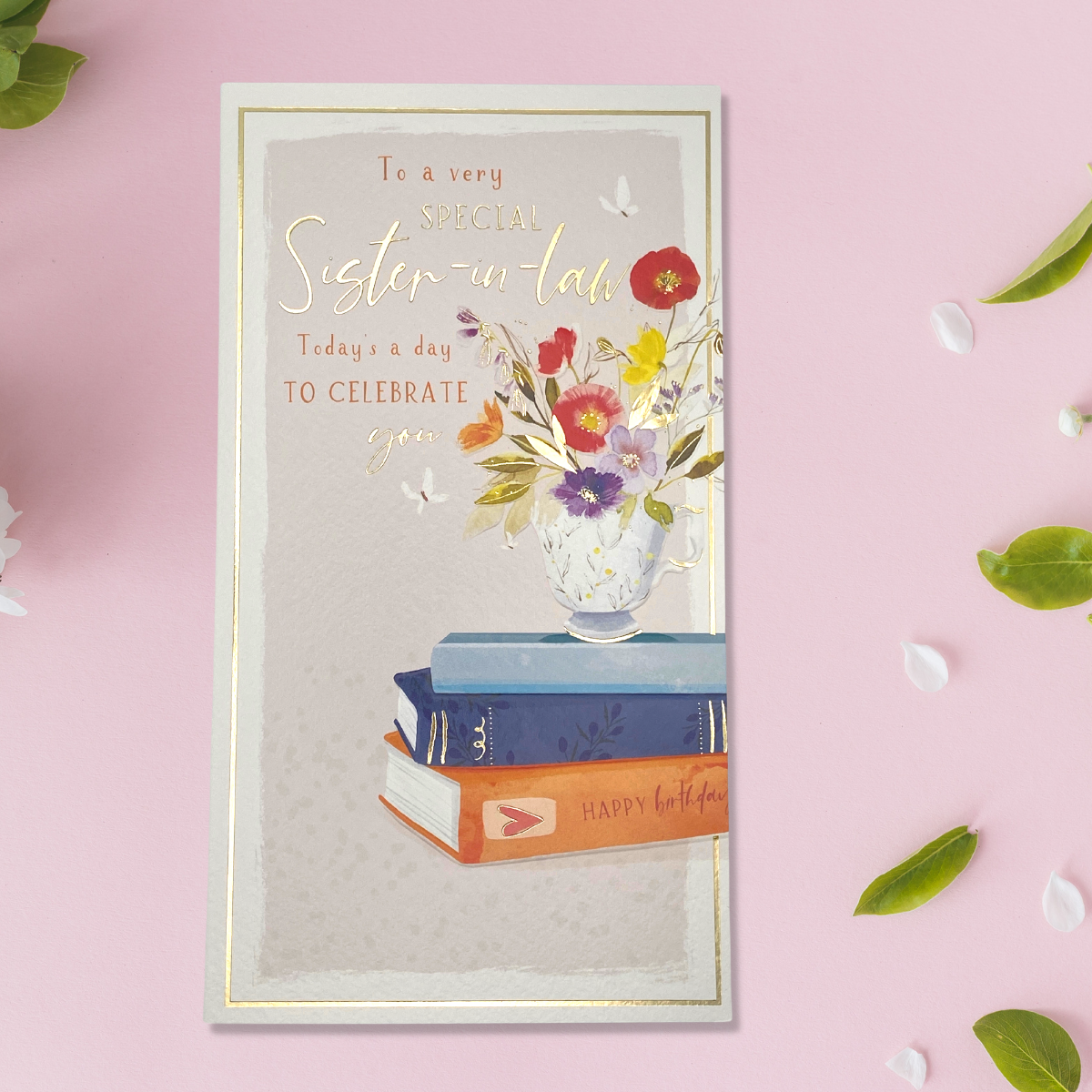 Slim card with book and floral vase with gold foil text and border