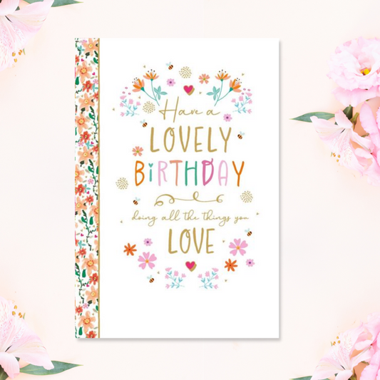 White card with floral border and pretty coloured text