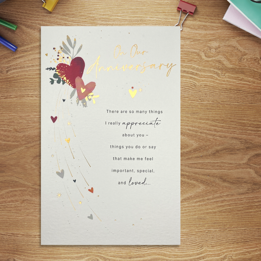 White card with heartfelt words and hearts, with gold foil accents