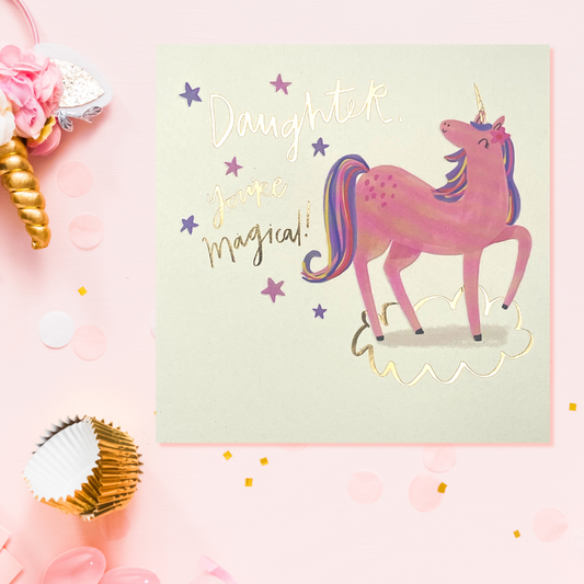 Square card with cream background and pink and purple unicorn