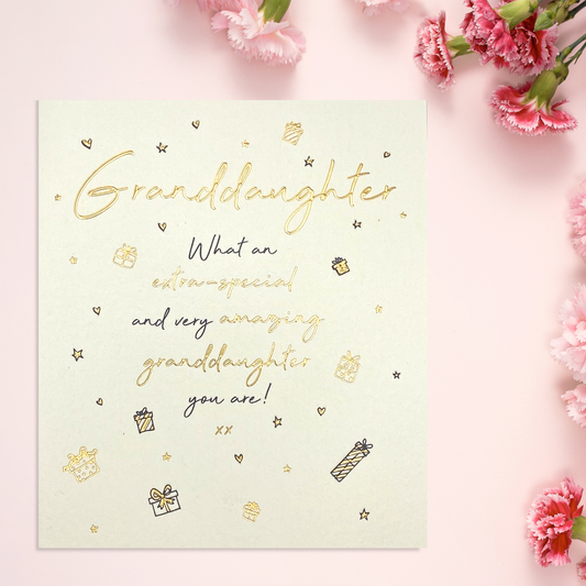 Cream square card with gold and black text and doodles